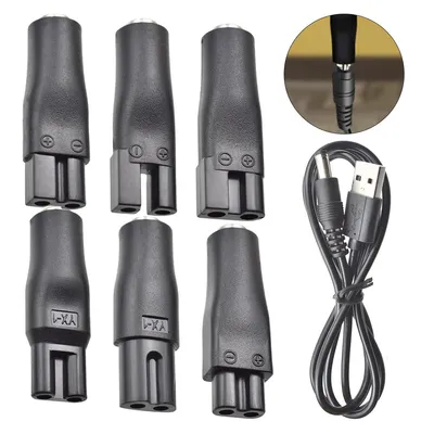 A collection of black USB adapters and cables arranged on a white background.