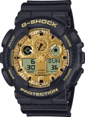 A close-up studio shot of a black and gold Casio G-Shock watch.