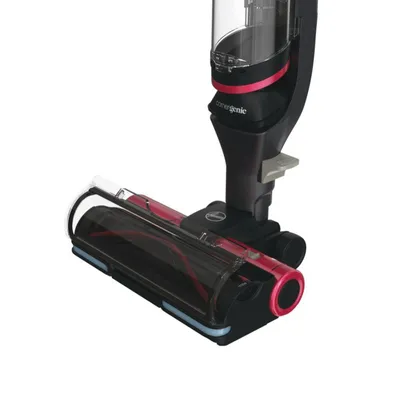 Close-up of the brush head and part of the dustbin of a cordless vacuum cleaner.