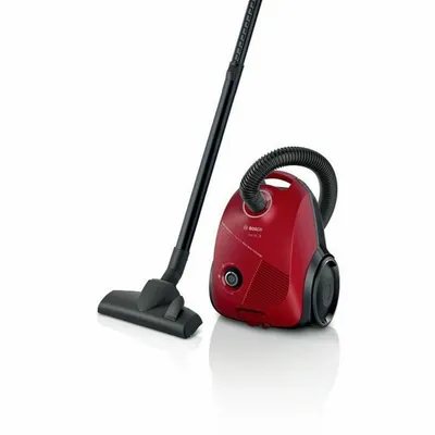 A red Bosch Serie 2 cylinder vacuum cleaner with its black hose and wand is displayed on a white background.