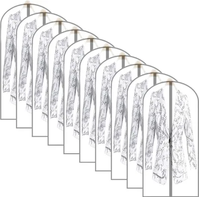 Multiple garment bags with clothes inside, arranged in a diagonal line.