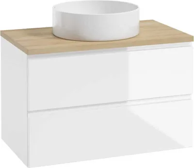 A white basin sits on a wooden countertop of a white cabinet with two drawers.