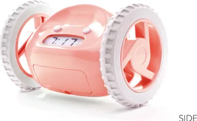A pink alarm clock with wheels is shown against a white background.