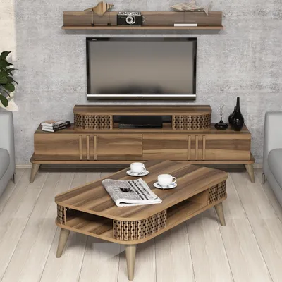 A living room scene with a TV stand, TV, and coffee table.