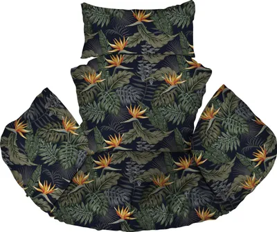 A hanging chair cushion with a tropical leaf and bird of paradise flower pattern.