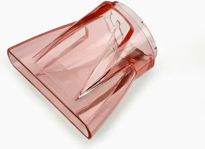 A pink hairdryer nozzle is shown against a white background.
