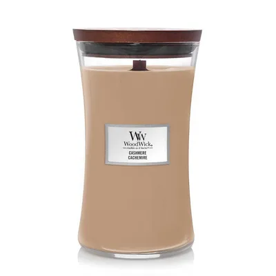 A WoodWick candle with a wooden lid, shown against a white background.