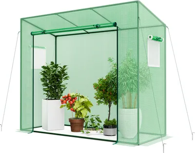 A green greenhouse with plants inside, set against a white background.