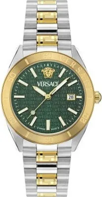 A close-up studio shot of a two-tone watch with a green dial.