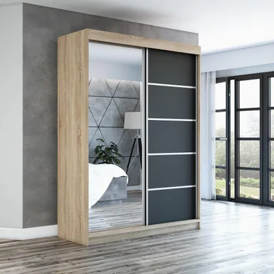 A bedroom scene with a large sliding door wardrobe.
