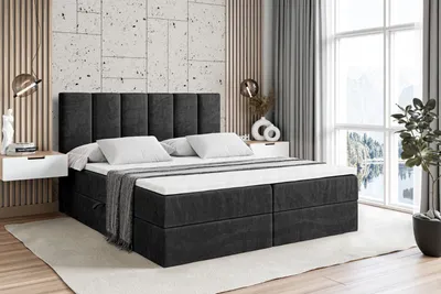 A bedroom scene with a large bed, nightstands, and a window with a view.