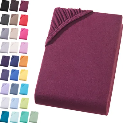 A folded fitted sheet is shown with a swatch of many other colors to the left.