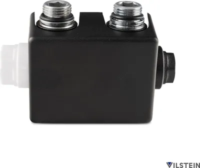 A product shot of a black plumbing fitting with silver threaded connectors and a white plastic insert, set against a white background.