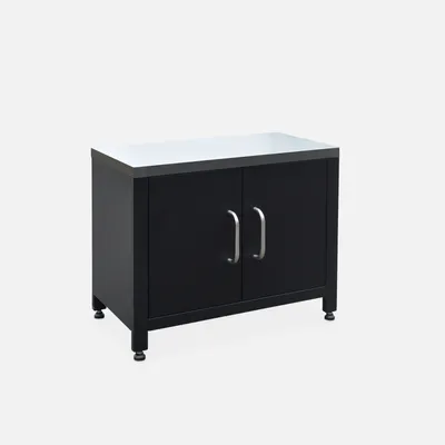 A black cabinet with a silver top and silver handles against a light gray background.