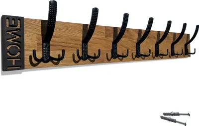 A wooden coat rack with black hooks mounted on a white background.