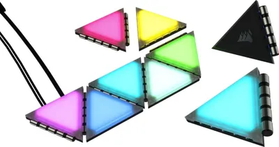 A collection of triangular LED light modules arranged in a scattered pattern against a white background.