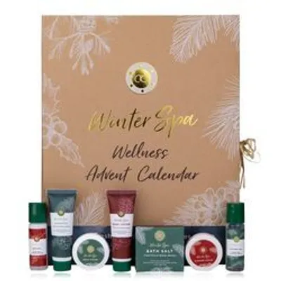 A beauty advent calendar with various spa and wellness products displayed in front of it.