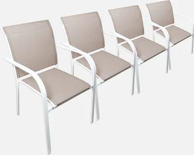 Four outdoor chairs are lined up against a white background.
