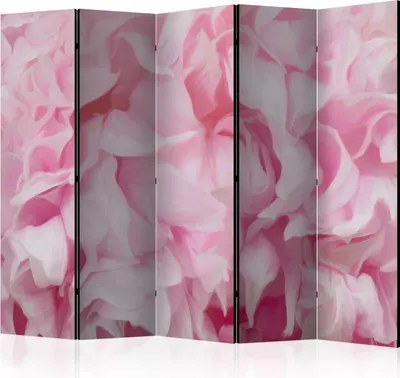 A close-up, full-frame view of a room divider with a floral pattern.