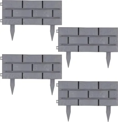 Four grey plastic garden edging pieces designed to look like brickwork, arranged in a grid.