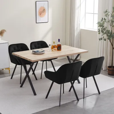 A dining set with a wooden table and four black chairs in a room.