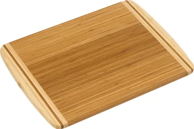 A bamboo cutting board is shown from a slightly elevated angle against a white background.