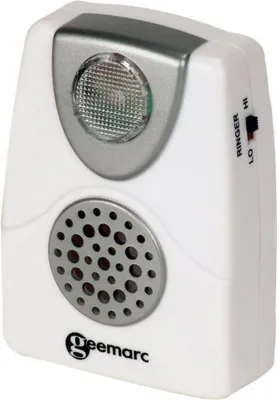 A white Geemarc CL11 acoustic telephone ringer with a flashing light and speaker.