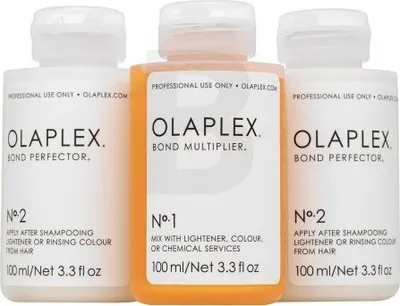 Three bottles of Olaplex hair treatment products are displayed against a white background.