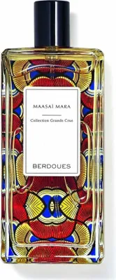 A perfume bottle with a colorful, patterned design.