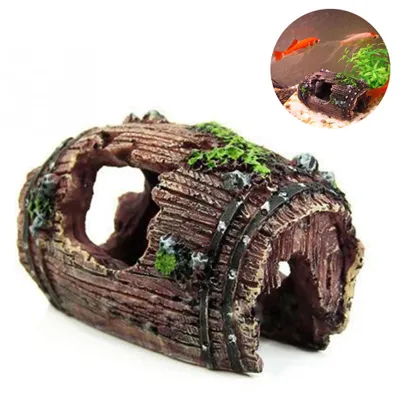 A resin aquarium decoration resembling a hollowed-out, weathered log or barrel, with mossy accents.