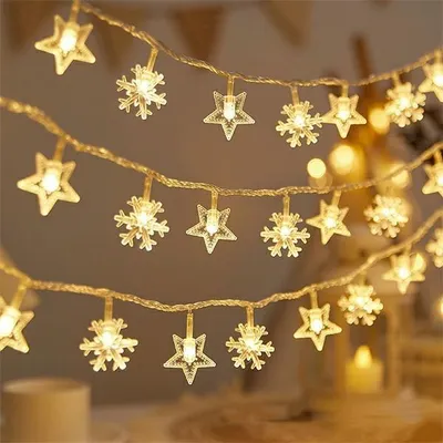 Immagine prodotto di Luci a led per albero di Natale fiocco di neve/stella - 10M/80 luci bianco caldo, alimentate da batterie 3Xaa Ehd-Ls06