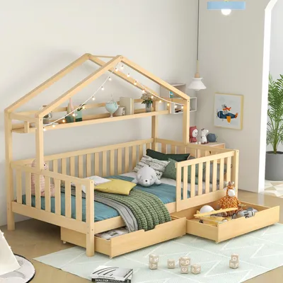 A child's bed with a house frame, shelves, and storage drawers, decorated with fairy lights and toys.