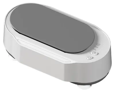 A white ultrasonic cleaner with a gray lid, shown from a diagonal angle on a white background.