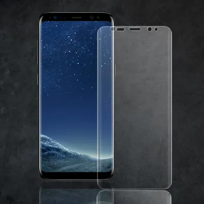 A smartphone with a screen protector placed next to it, on a dark textured background.
