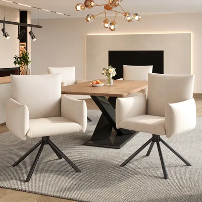 A dining room setting with a wooden table and four beige chairs.