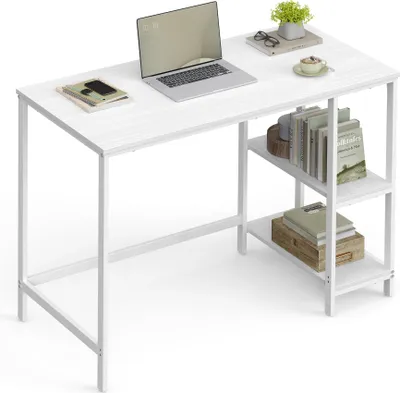 A white desk with a laptop, books, and a plant on it, set against a white background.