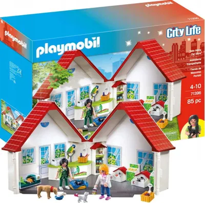 A Playmobil City Life portable pet shop playset is shown, with the packaging in the background.