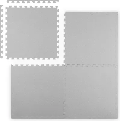 Four interlocking foam puzzle mats are arranged in a 2x2 grid, with one mat slightly offset to the top left.