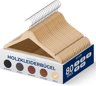 A stack of wooden clothes hangers is displayed in front of a box with product information.