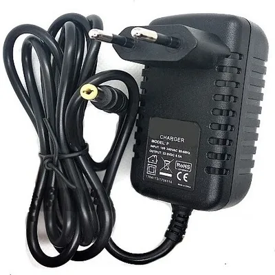 A black power adapter with a coiled black cable and a European plug.