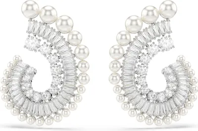 A pair of elegant pearl and diamond earrings.