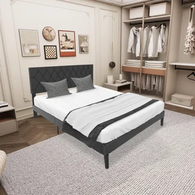 A bedroom scene with a bed, closet, and artwork on the wall.
