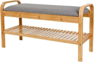 A wooden bench with a gray cushion and two slatted shelves.