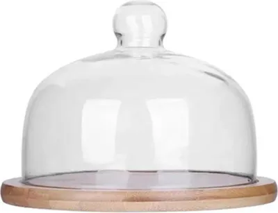 A glass dome cake stand with a wooden base.