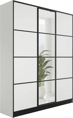 A white wardrobe with black framing and glass doors, reflecting a plant in a pot.