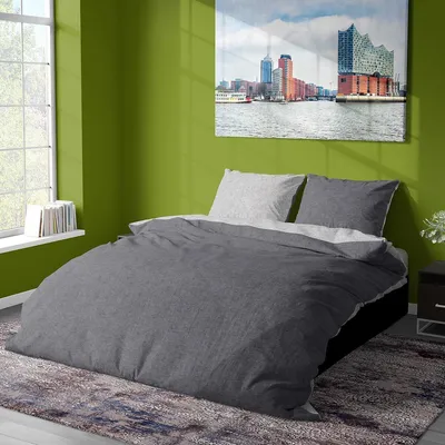 A bedroom scene with a bed, a window, and a painting on the wall.