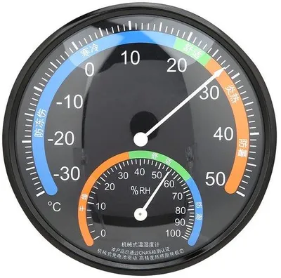 Produktbild von Thermometer mit runden Display, gebogenem Glas, Binnenfeuchtigkeitssensor und flexibler Installation für genaue Temperaturmessung.