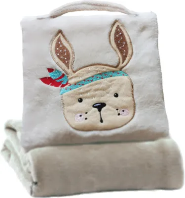 A folded baby blanket with a stuffed animal face design on the top part.
