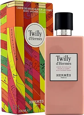 A bottle of Hermès Twilly d'Hermès Body Shower Cream and its colorful packaging are displayed.