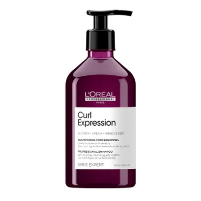 A bottle of L'Oréal Professionnel Curl Expression shampoo with a pump dispenser.